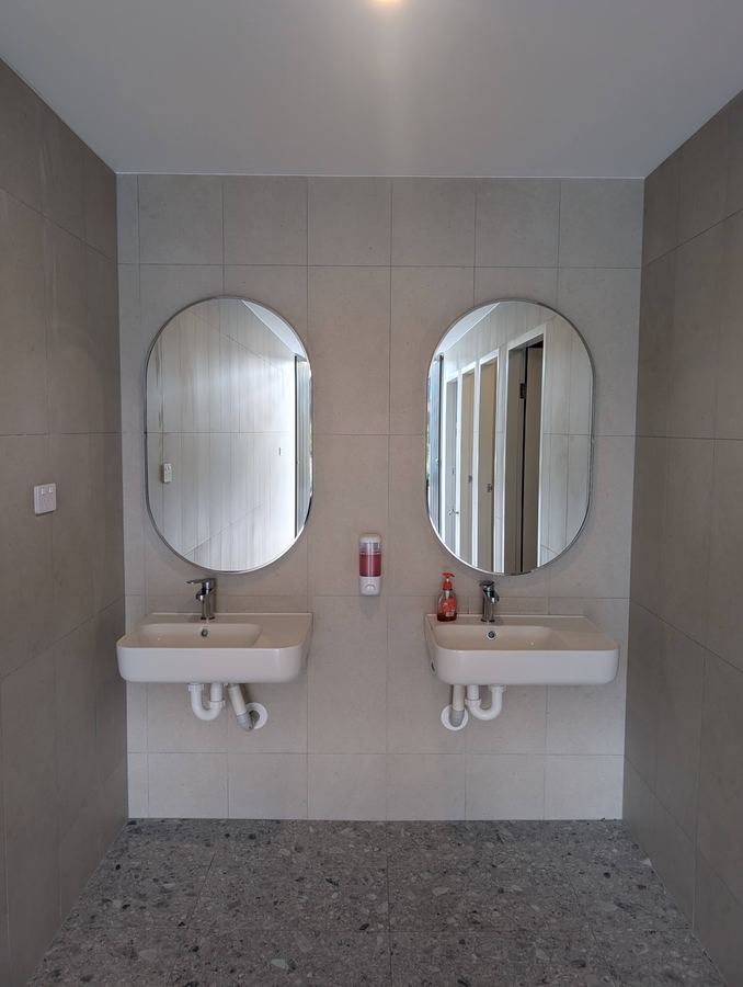 Twin basins in a communal bathroom